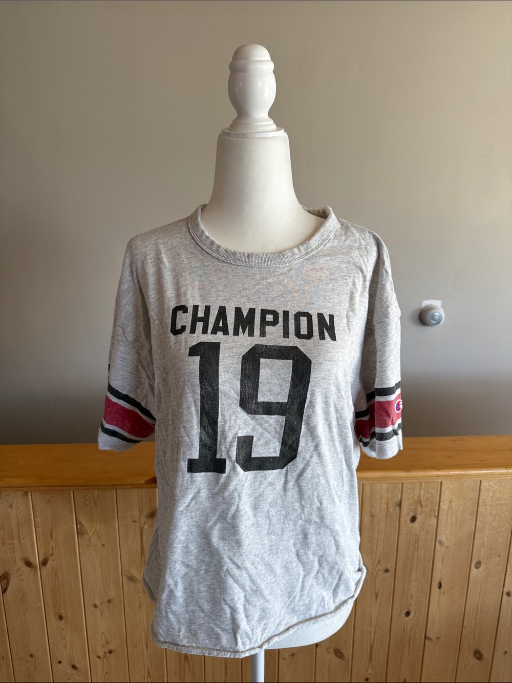 Champion Gray Graphic Tee with Black Print and Red Sleeve Stripes